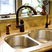 Undermount stainless steel sink with oil rubbed bronze faucet fixtures